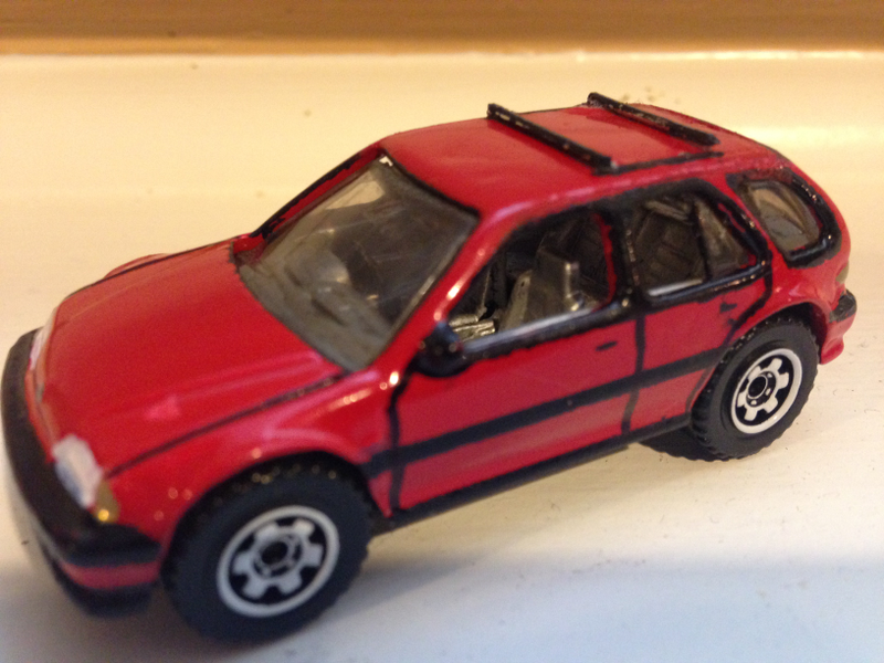 Wheels borrowed from a Matchbox and lifted by filing the chassis a bit